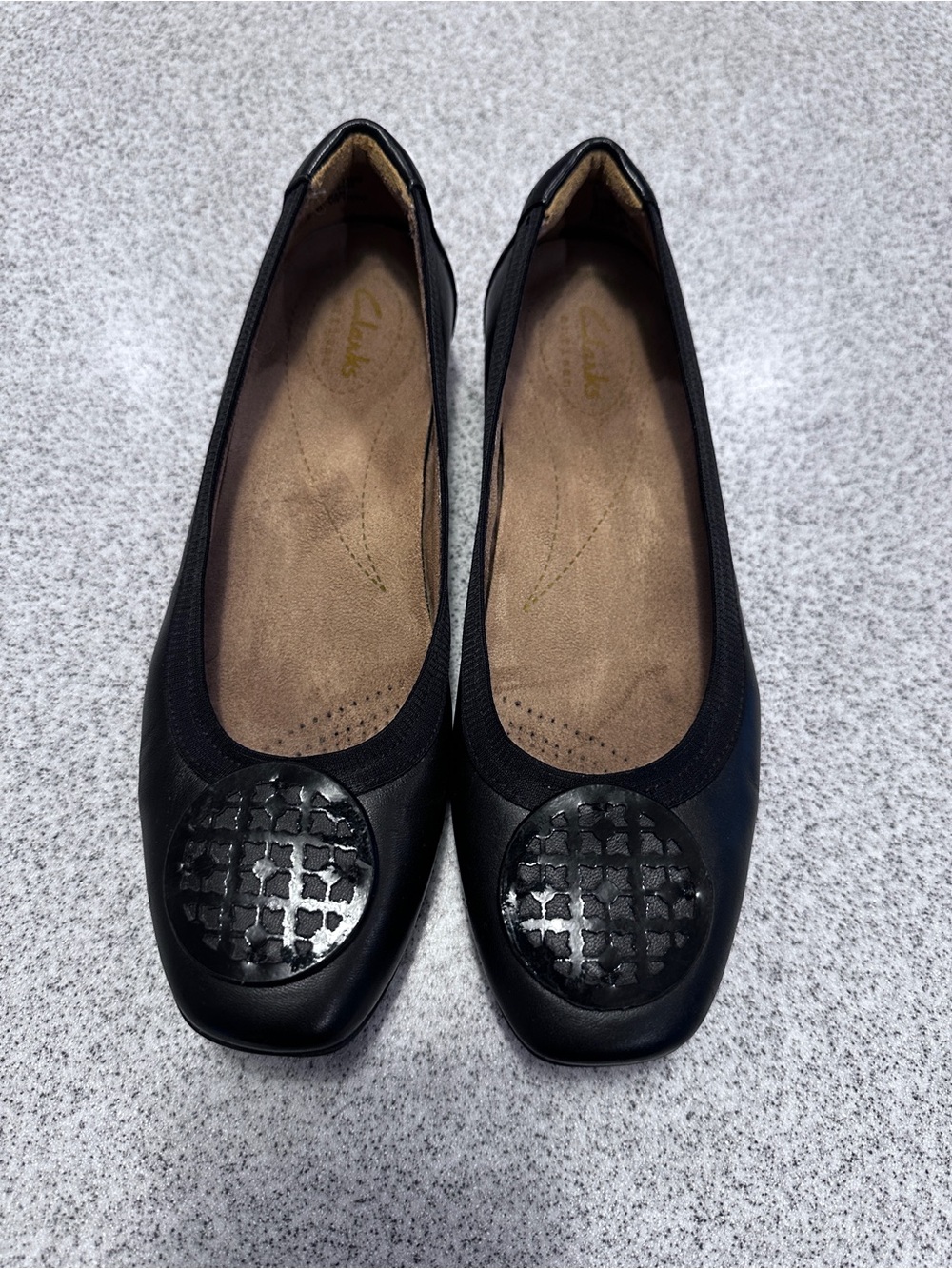 Clarks Black Leather Women's Ballet Flats with Textured Medallion